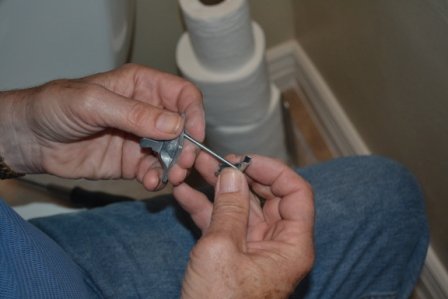 how to fix a broken toilet paper holder toggle